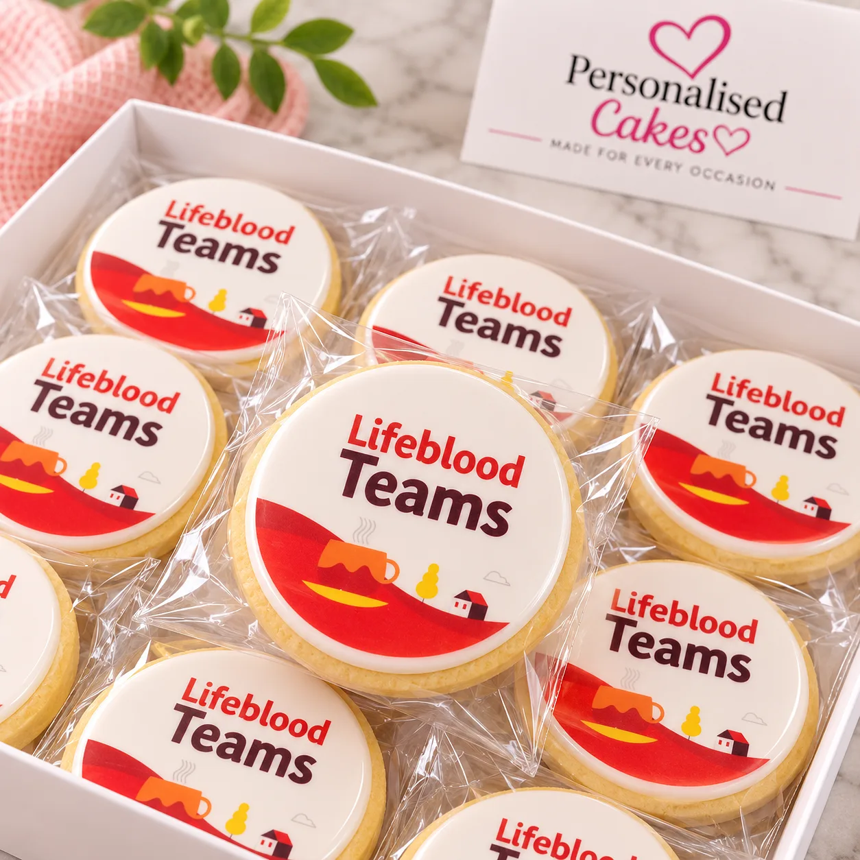 Lifeblood Teams logo cookies in a gift box