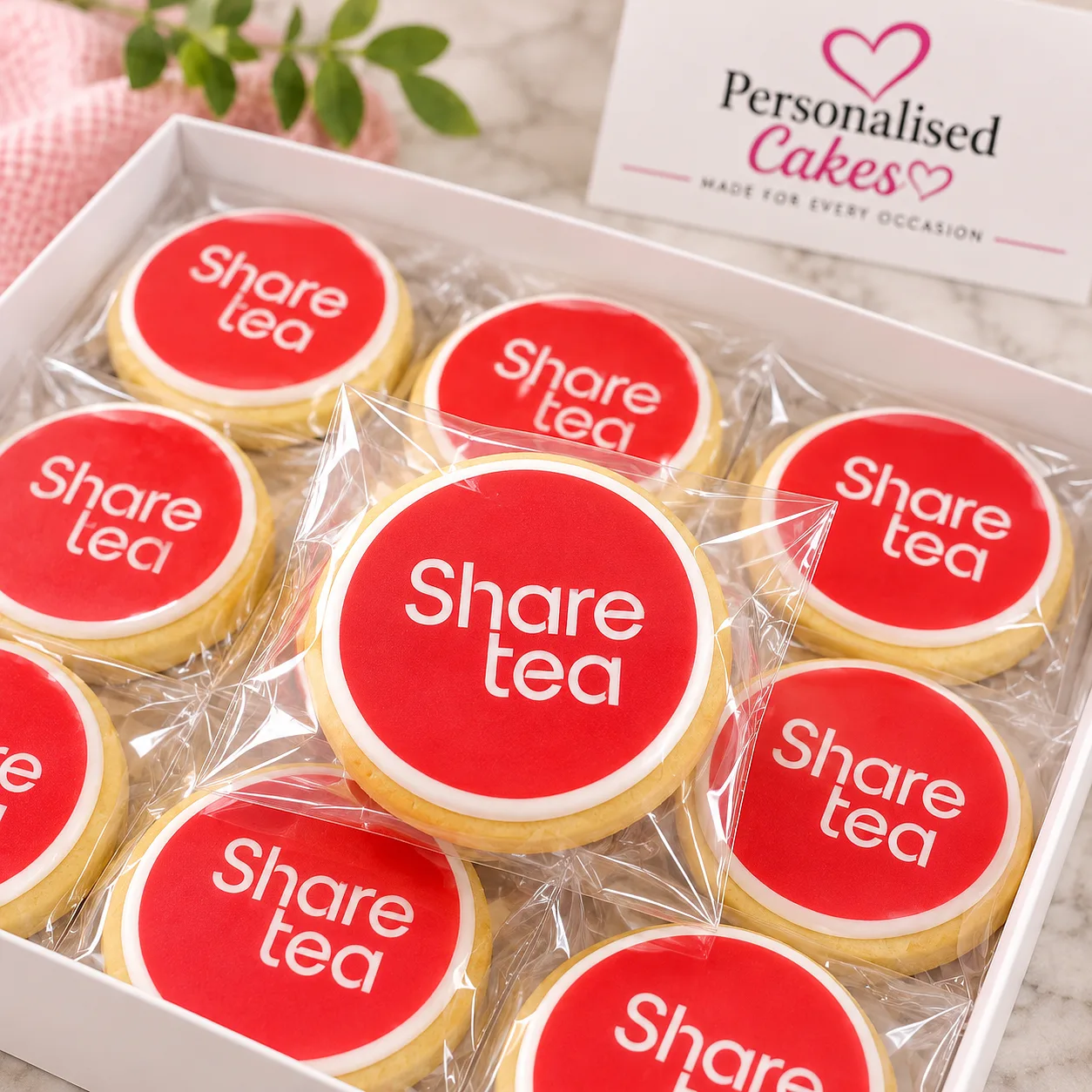 Sharetea logo cookies in a gift box