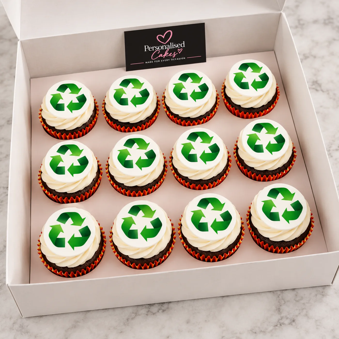 Recycling symbol branded cupcakes