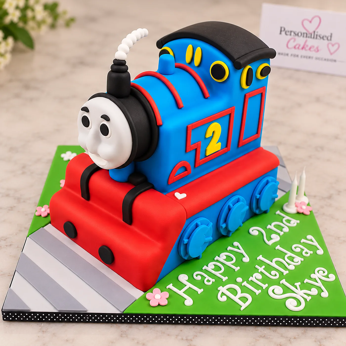 Blue and red Thomas the Tank Engine second birthday cake for Skye