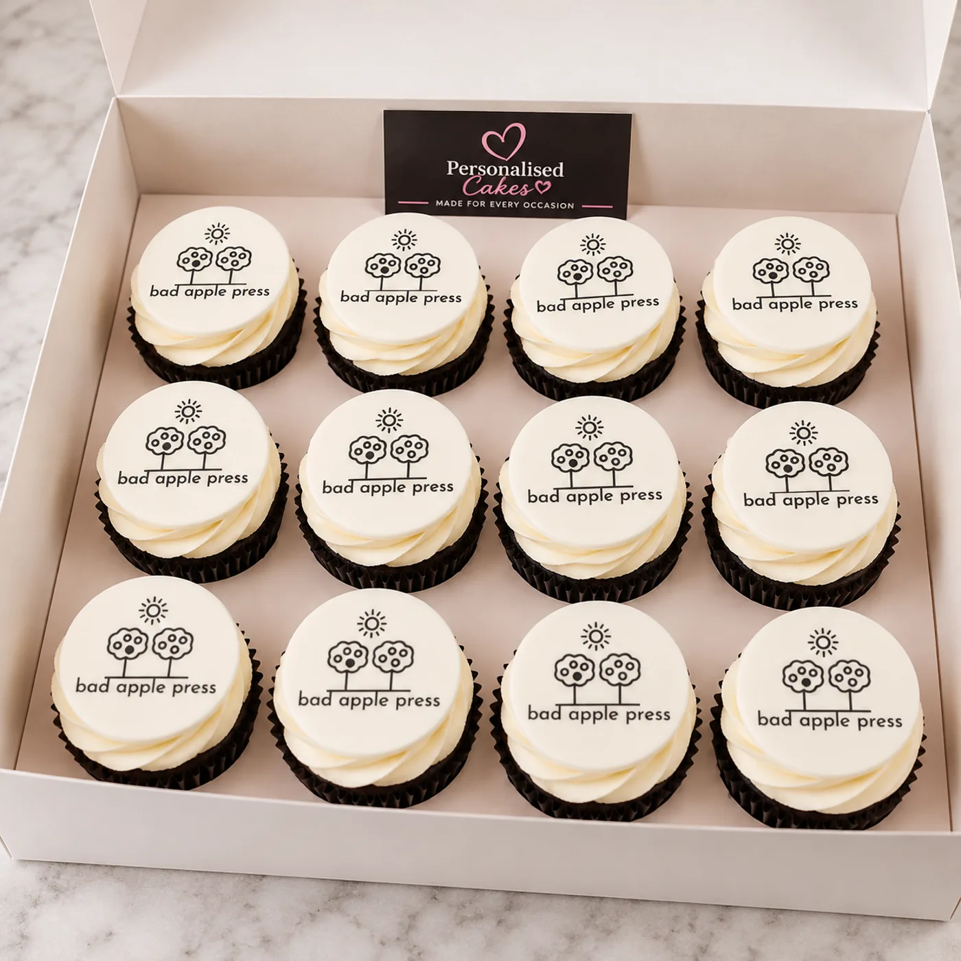 Bad Apple Press branded cupcakes