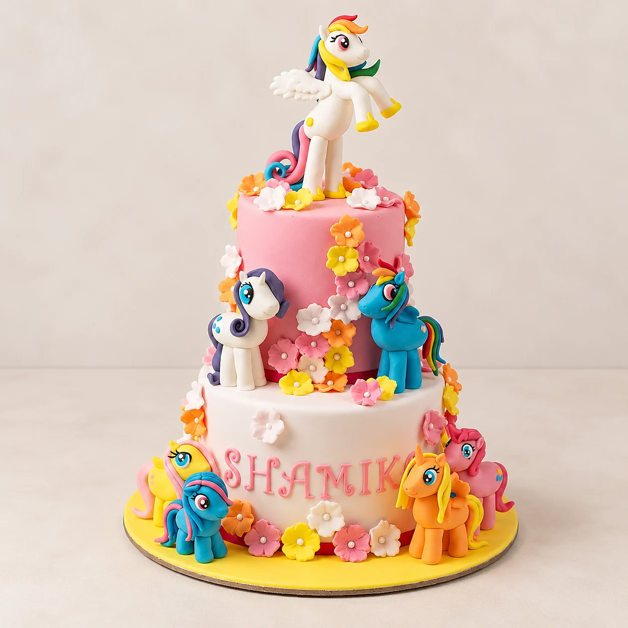 Tall multi-tier pony cake with sugar flowers