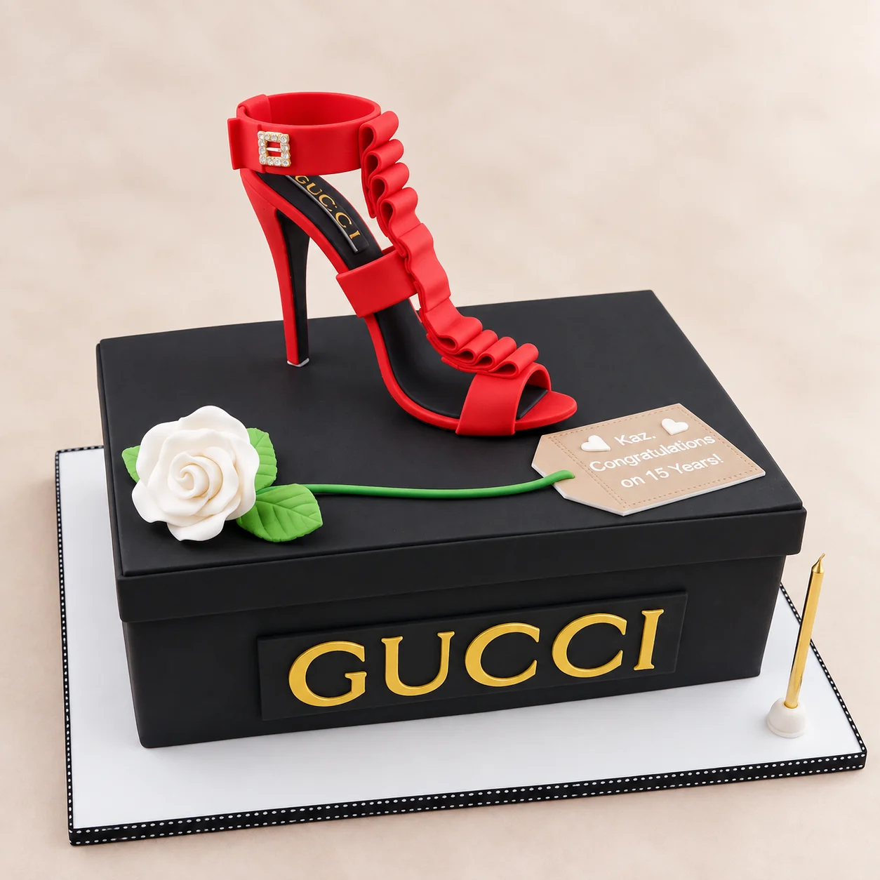 Gucci shoebox birthday cake with a red high heel topper