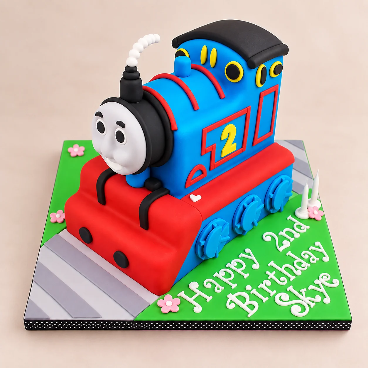 Blue and red Thomas the Tank Engine second birthday cake